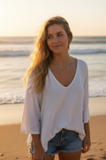 Pink and silver necklace worn at the beach